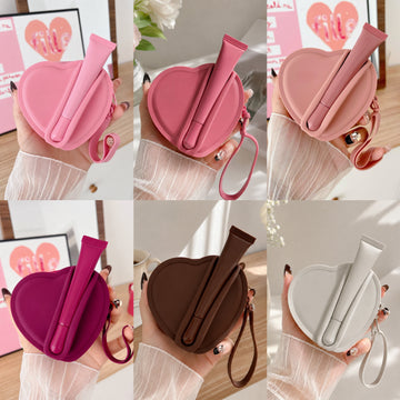 Wobomatic Heart Silicone Keychain Bag with lip gloss holder and wristlet strap - minimal luxury flat lay styling