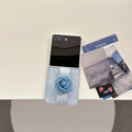 Aesthetic flat lay of Samsung Z Flip 6 denim flower phone case alongside aesthetic photo cards on a neutral table.