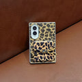 Back view of Samsung Galaxy Z Fold case with chic leopard pattern and matching bow tied across compact mirror door