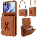 Brown leather Samsung Galaxy Z Flip wallet case with bow flap detailing, detachable wristlet, crossbody strap, and open card pouch