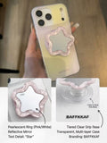 Close-up of pink pearlescent star flower phone grip showing the reflective mirror center.