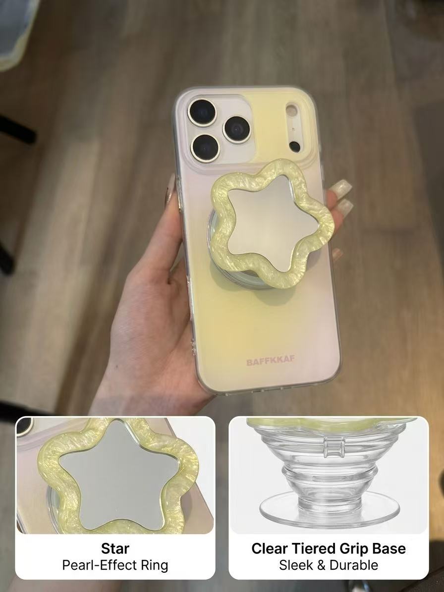 Close-up of yellow pearlescent star flower phone grip showing the reflective mirror center.