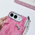 Close-up shot of hot pink glitter lace case for iPhone DUO highlighting raised camera bezel protection ring and crystal rhinestone bow embellishment.