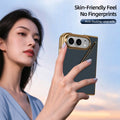 Close-up lifestyle shot of a woman holding the dark blue Kevlar texture iPhone DUO folding case with gold electroplated borders, featuring feature callout.