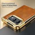 Close-up of electroplated lens protection frame on tan leather iPhone DUO case