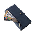 Close-up of navy blue leather wallet case zipper pocket filled with cash, coins, and credit cards.