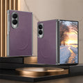 Dark plum purple leather magnetic folding phone case featuring clear edge protection and a dual camera cutout, shown from front and back angles.