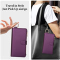 Dark purple leather phone pouch attached to a handbag using the quick-release metal ring clip