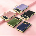 Five color lineup of iPhone DUO luxury chevron quilted leather cases in Pink, Purple, Green, Blue, and Black with electroplated gold trim and finger ring holders.