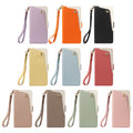 Flat lay color grid displaying all 10 color variations of the dual-tone leather wallet case with matching wristlet straps, including Lavender, Orange, Black, Yellow, Sky Blue, Coral, Beige, Taupe, Sage Green, and Pink.