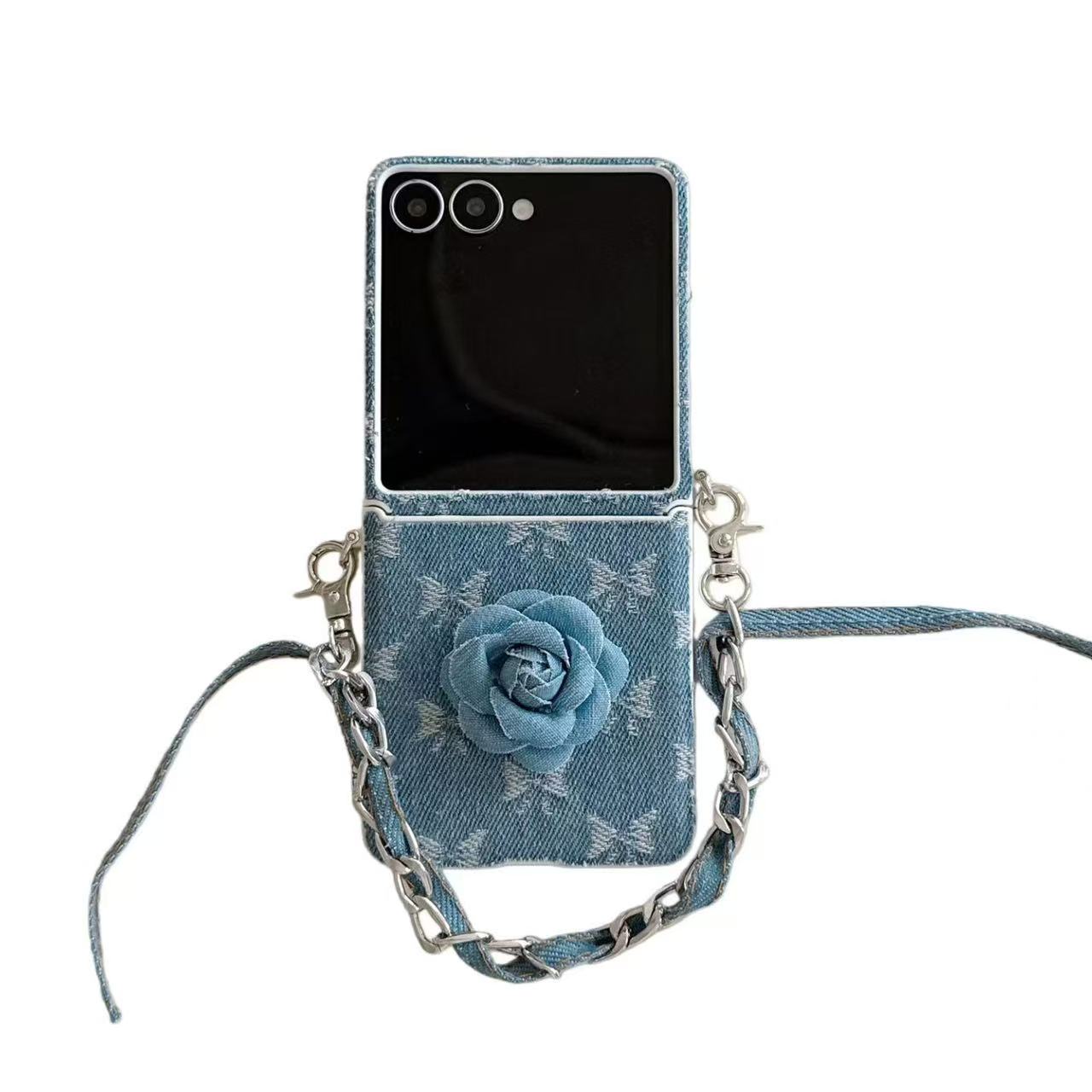 Isolated front view of Samsung Galaxy Z Flip denim camellia flower case with attached wrist strap.