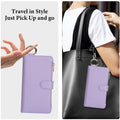 Light lavender purple leather wallet case for Samsung Galaxy A57 A56 A55 held by single ring hook and attached to a handbag for travel convenience.
