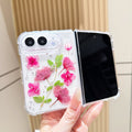 Open view of a hand holding the clear iPhone DUO case showcasing the full real pressed pink flower arrangement alongside the active display screen.