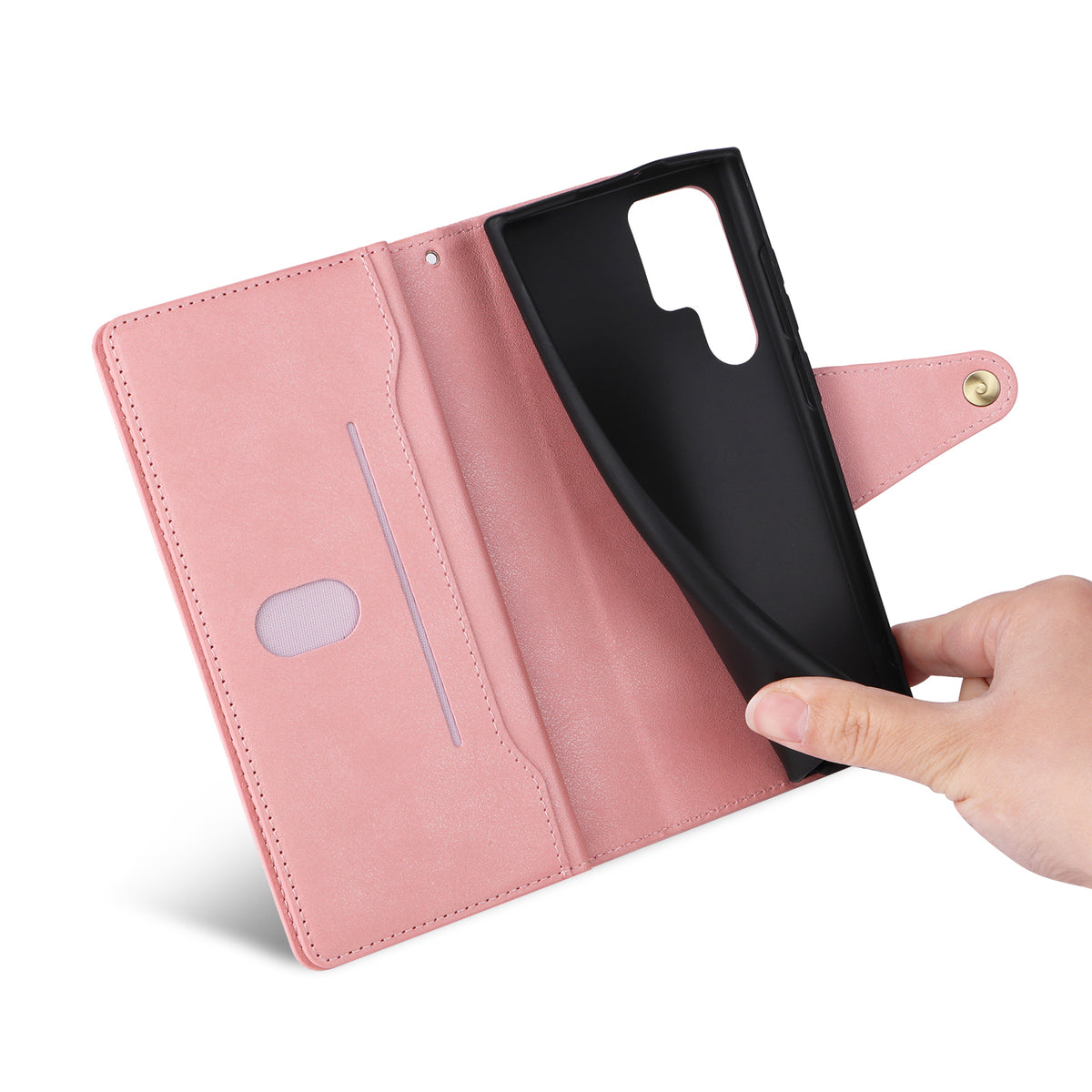 Open view of soft rose pink leather wallet case showing flexible inner black TPU shell being adjusted by hand.