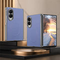 Periwinkle blue leather folding phone cover with magnetic ring detail and clear side frame, shown open displaying winter scene wallpaper.