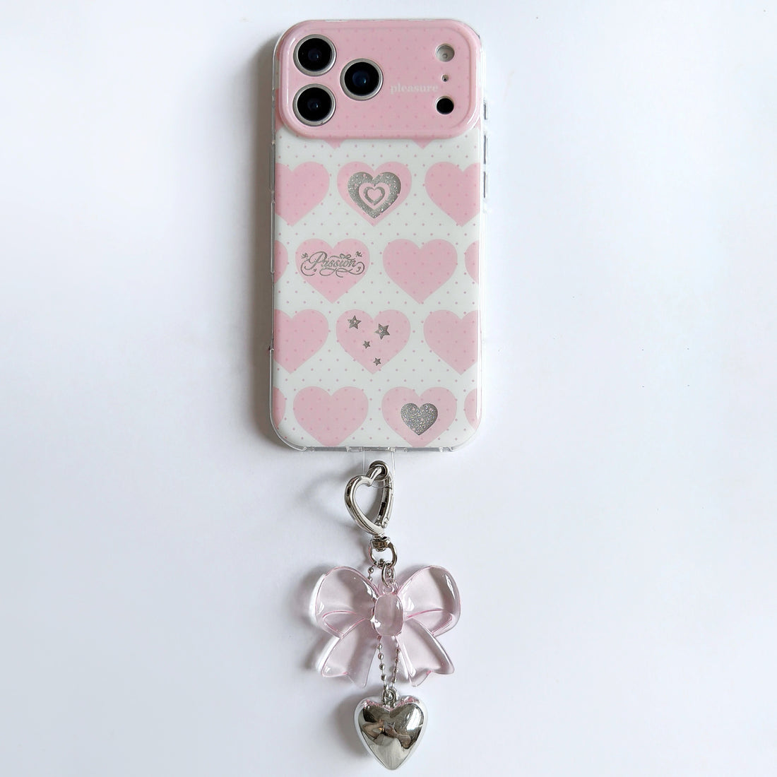 iPhone heart pattern phone case with bow charm showing double-layer IMD gradient design with colorful hearts and silver glitter accents