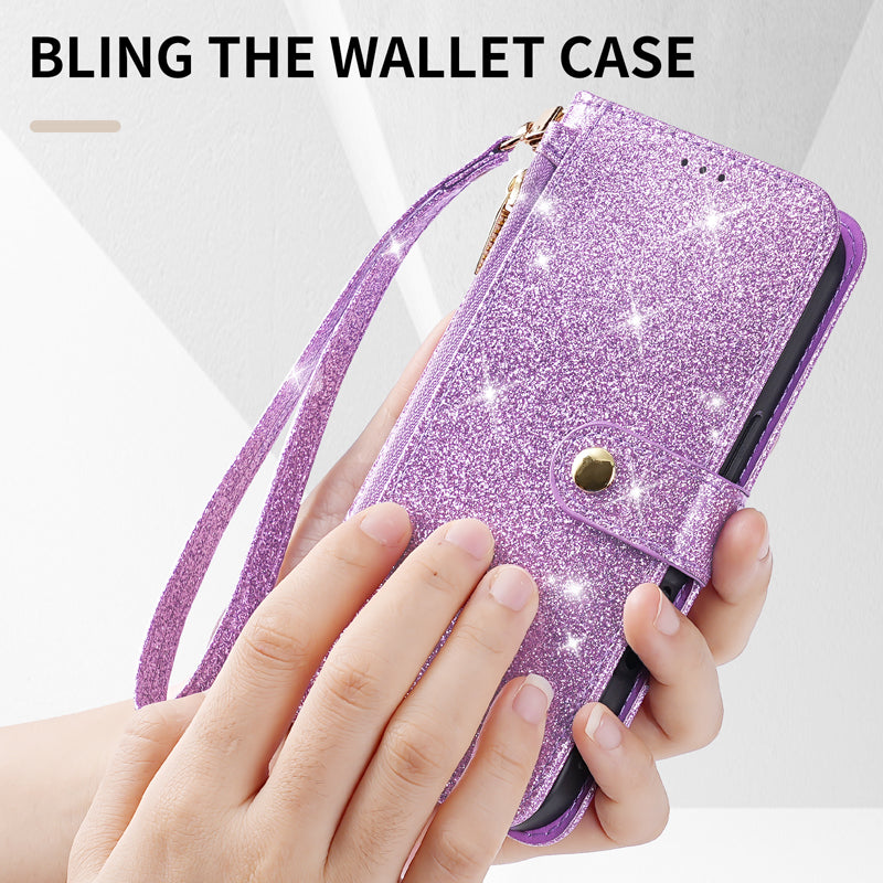Purple glitter leather phone wallet case with wristlet strap held in hand showing sparkling texture and magnetic clasp.