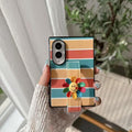 Retro rainbow striped leather phone case for Samsung Galaxy Z Fold featuring built-in smiley flower grip strap held in hand