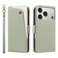 Sage green dual-tone leather wallet case for iPhone showing the front angled snap card pocket, camera cutout, and matching wristlet lanyard.