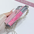 Side profile of hot pink floral lace case for iPhone DUO displaying slim dual-layer shell construction and attached pearl bow lanyard chain strap.