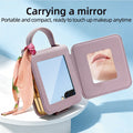 Unfolded purple Samsung Galaxy Z Flip case revealing the integrated makeup mirror inside the leather flap