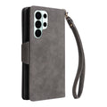 Vintage grey leather wallet phone case closed view with camera cutouts, magnetic snap closure, and detachable wristlet strap.