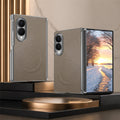 Warm taupe brown leather folding smartphone case with magnetic ring, featuring clear protective borders on a metallic display stand.