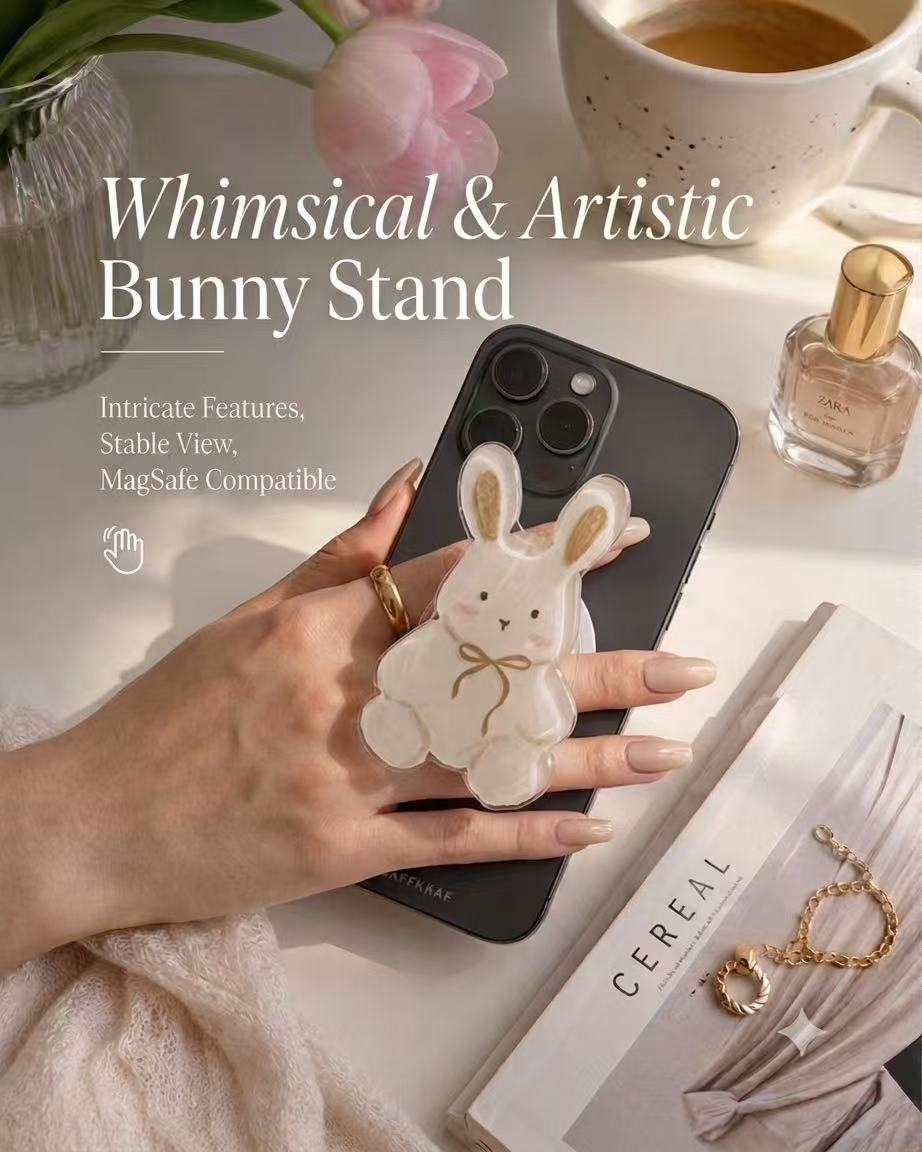 Whimsical acrylic bunny MagSafe phone grip held on a black iPhone with modern aesthetic lifestyle backdrop