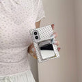 White polka dot Samsung Galaxy Z Fold 8 phone case with the built-in compact mirror flipped open.