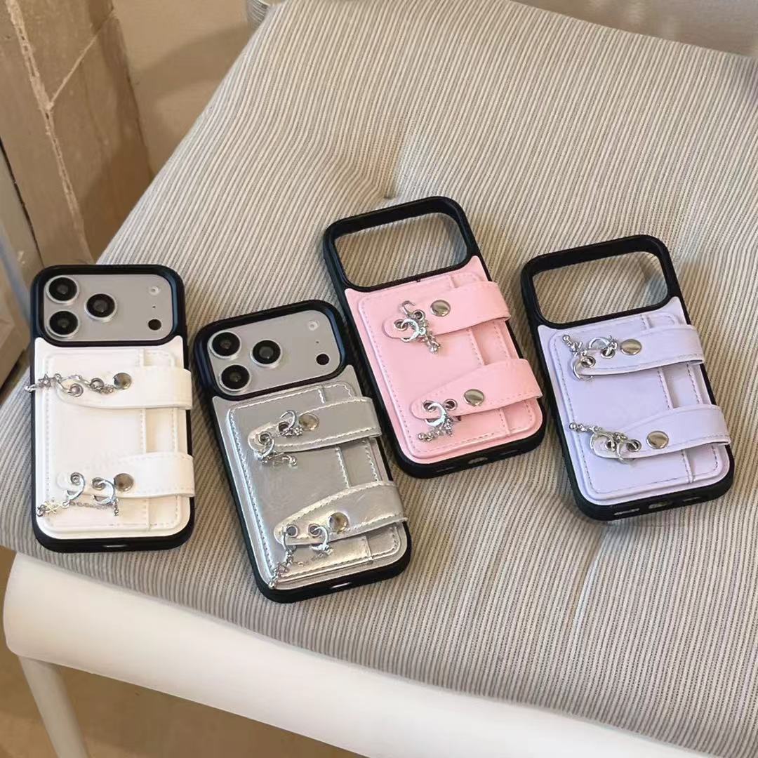 Wobomatic Y2K buckle strap wallet case for iPhone in all four colours — White, Silver, Pink and Lavender Purple — vegan leather with metallic charms and dual buckle straps, compatible with iPhone 13-17