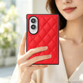 Woman holding a vibrant crimson red quilted diamond leather case on a folded Samsung Galaxy Z Fold 8