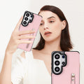 Woman holding soft pink leather crossbody wallet case for Samsung Galaxy featuring exterior zipper pocket