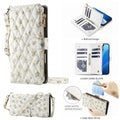 iPhone 18 Pro Max quilted floral leather case in soft white with small yellow and blue flowers, featuring a wristlet strap, adjustable crossbody strap, card slots, and zippered coin pocket