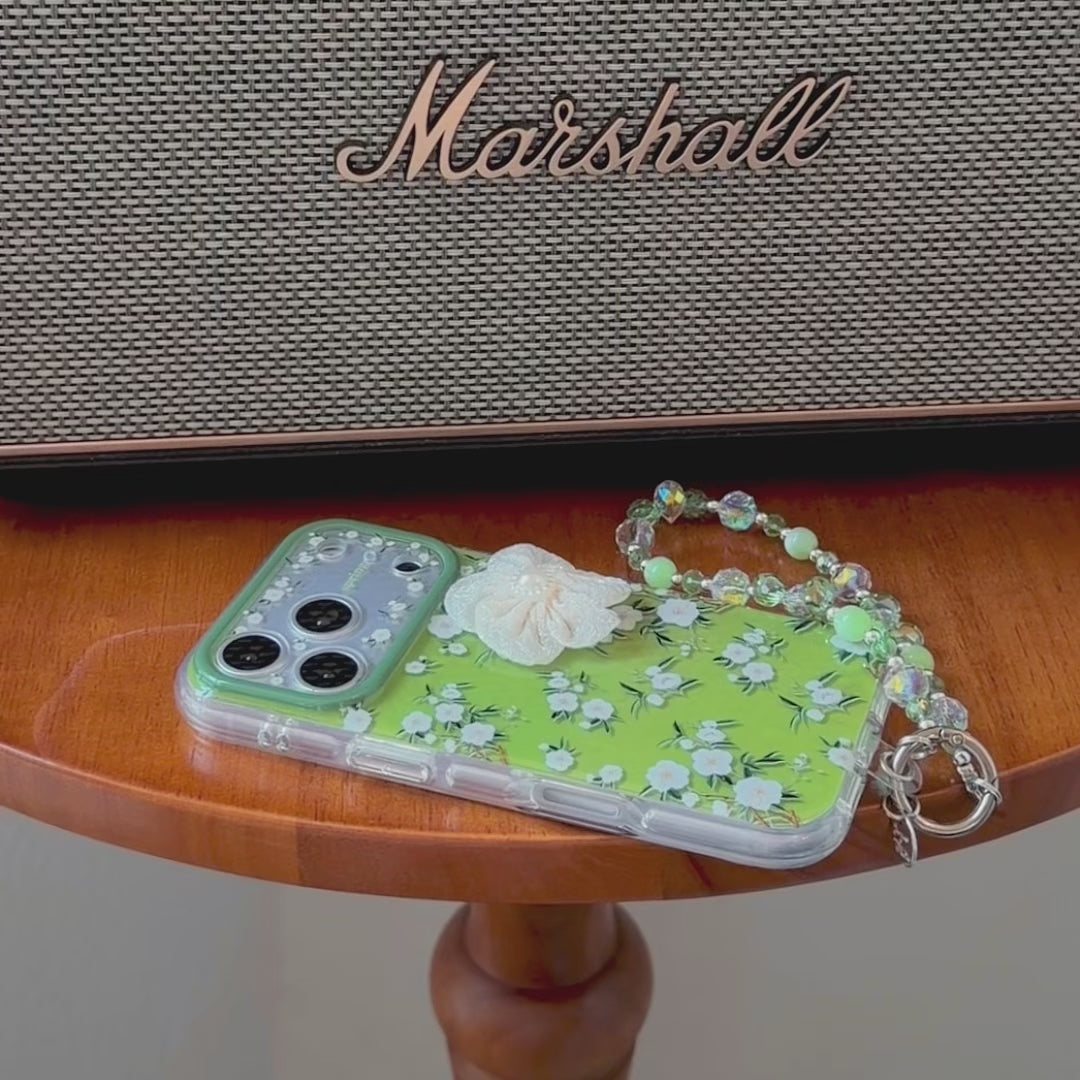 Video presenting the Floral iPhone case white flower prints with green leaves
